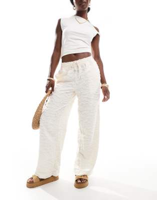 wide leg tie waist pants with textured applique in cream-White