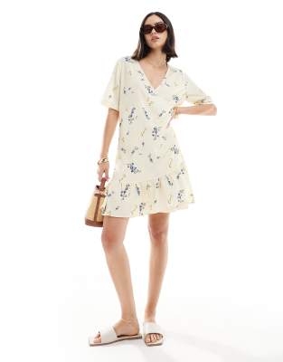 Vero Moda wrap front mini dress in light yellow floral