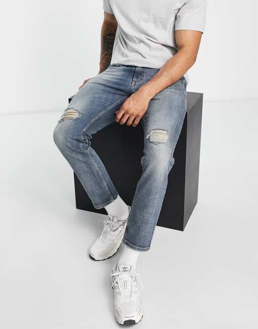 Versace Jeans Couture – Niebieskie jeansy o obcisłym kroju z przetarciami