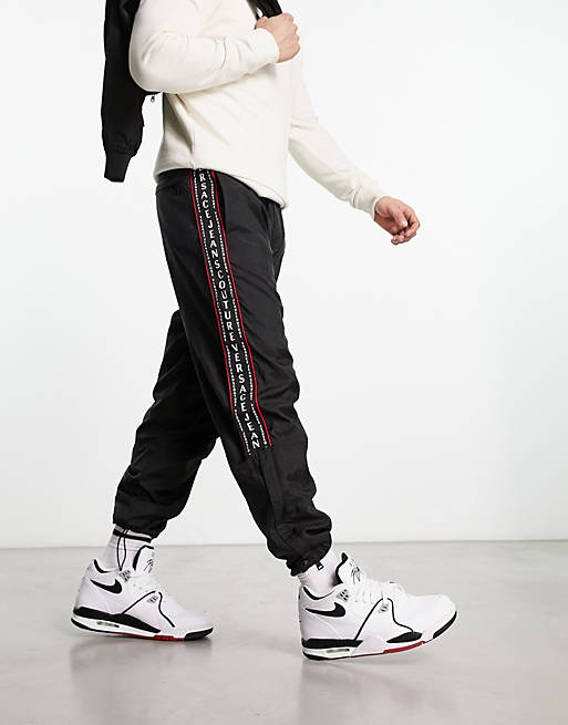 Versace Jeans Couture taping nylon trackies in black | ASOS