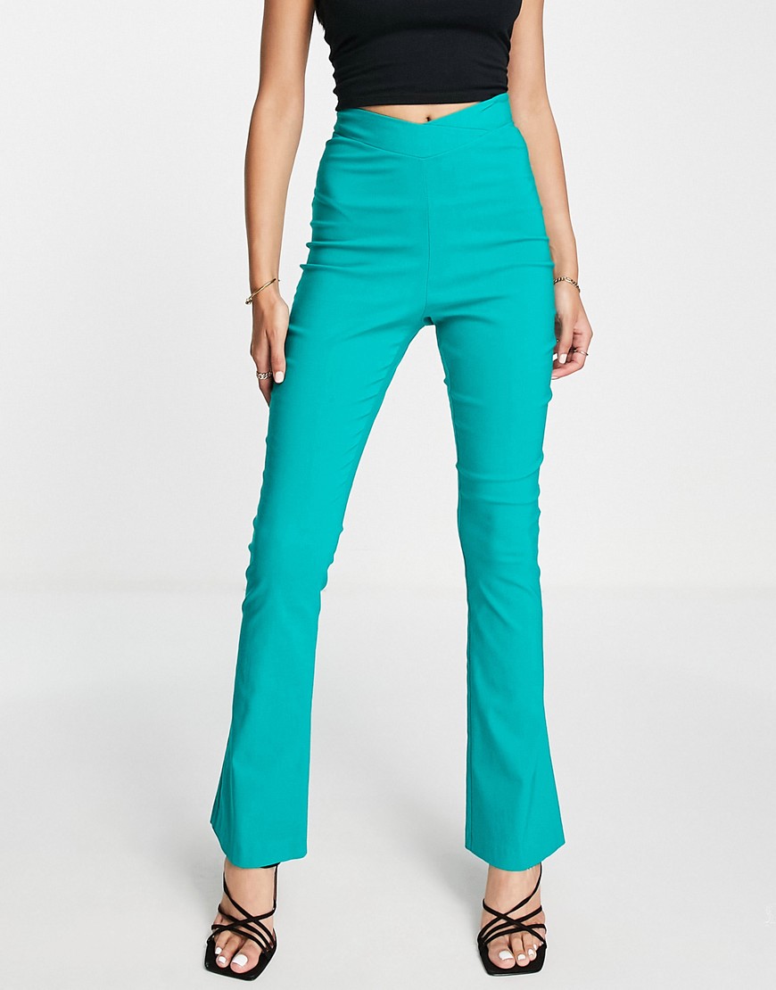 Vesper dipped waist flared trousers in turquoise-Green