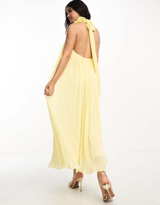 Vestido amarillo plisado con detalle tipo ramillete cuello alto y lazada trasera de ASOS DESIGN