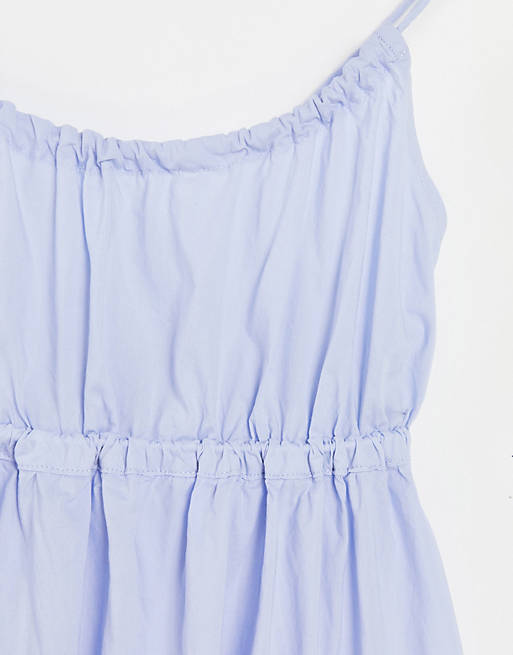 Vestido babydoll azul con espalda cruzada de algodón de Weekday - MBLUE |  ASOS