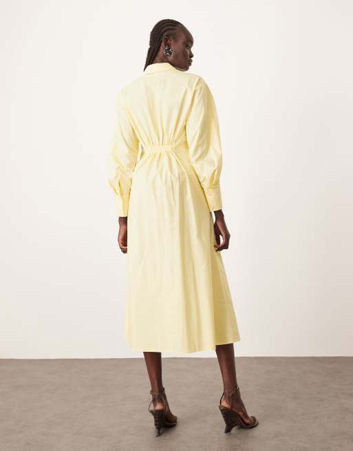 Vestido camisero midi amarillo pastel con cintura entallada