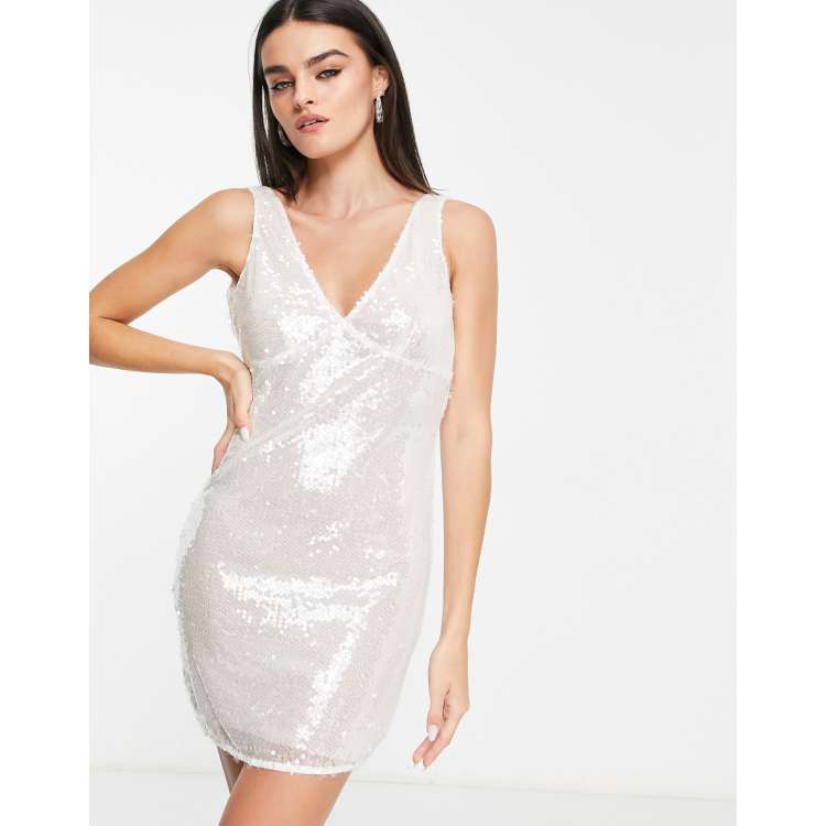 Vestido corto blanco escotado de tejido transparente con lentejuelas de Annorlunda |