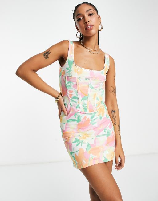 Vestido corto con estampado floral pastel, diseño estilo corsé y detalle de ribete de ASOS DESIGN