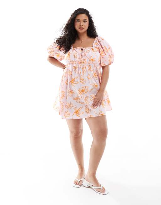 Vestido corto naranja amplio con estampado floral y mangas abullonadas de ASOS DESIGN Curve 