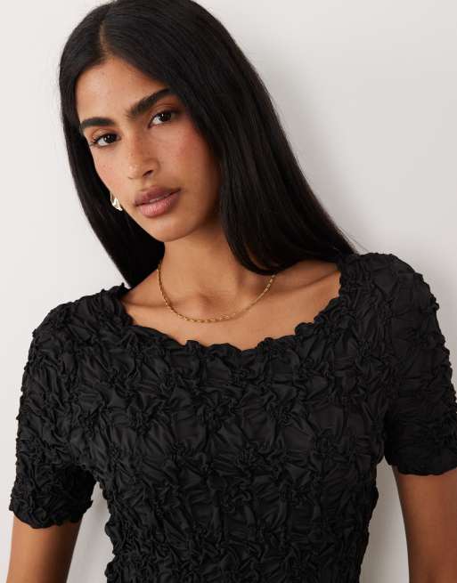 Vestido corto negro con vuelo de tejido texturizado tridimensional de YAS , 2 de 4