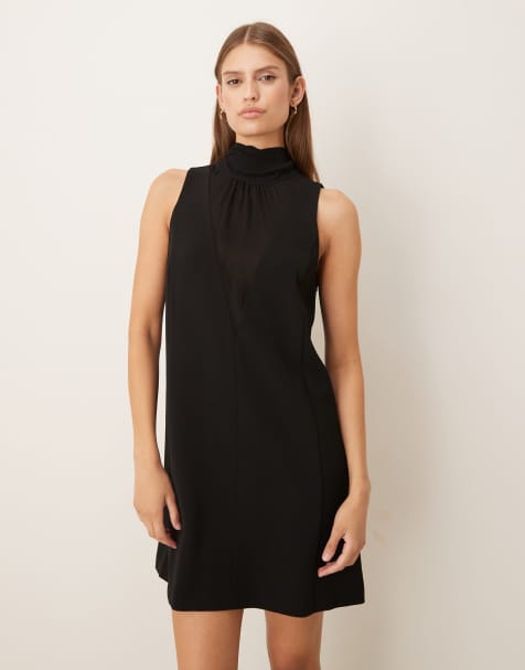 Vestido corto negro de corte recto con detalle de lazo y cuello halter de Mango - view 1