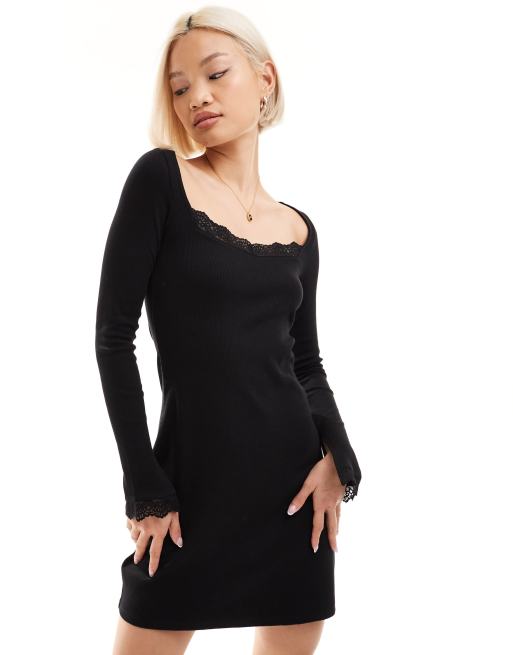 Vestido corto negro de manga larga con detalles de encaje de Monki