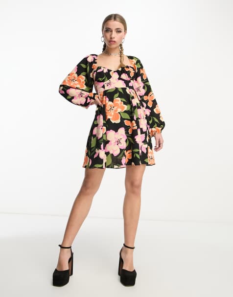 Vestido corto negro estilo babydoll de corte skater con espalda abierta, diseño de godets y estampado floral grande de ASOS DESIGN - view 1