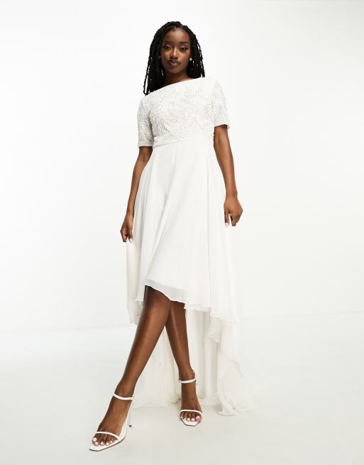 Vestido de novia color marfil con diseño 2 en 1 adornado y bajo asimétrico de Beauut