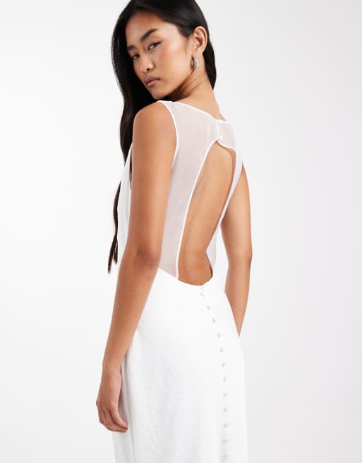 Vestido de novia largo blanco con abertura en la espalda y detalle