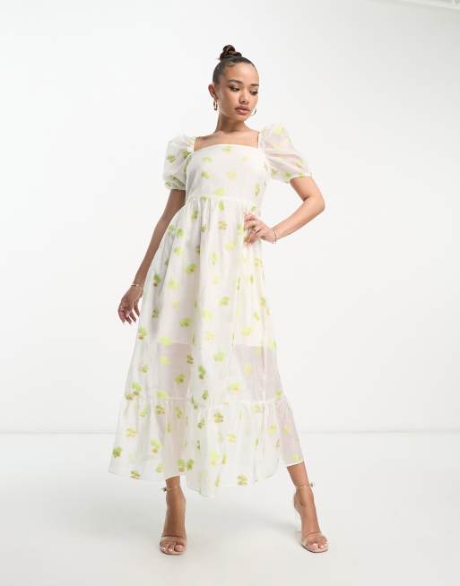 Vestido de tarde color marfil con mangas abullonadas y estampado floral de organza de Collective The Label