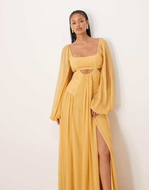 Vestido largo amarillo mostaza de manga larga con abertura y falda