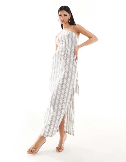 Vestido largo color crema a rayas con escote palabra de honor y detalle de lazada extragrande de Kaiia