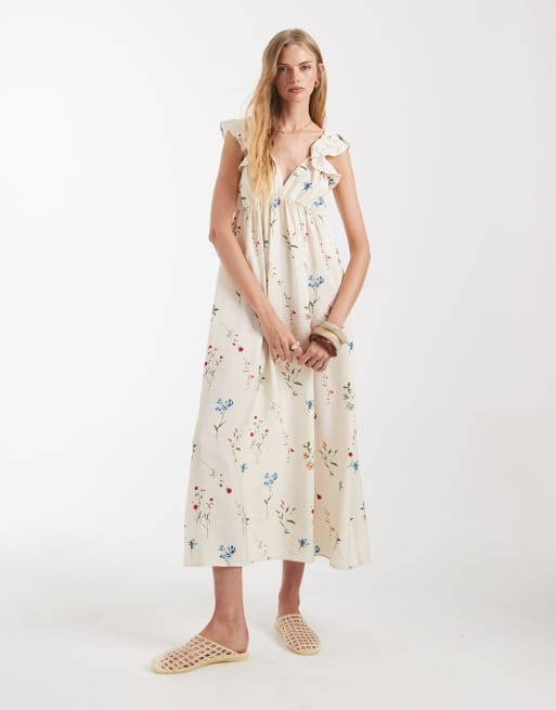 Vestido largo color crema con estampado floral, cuello de pico y volantes en los hombros de Vero Moda