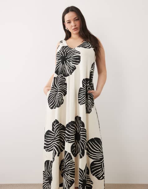 Vestido largo monocromático de tirantes y corte trapecio con estampado de hojas y cuello de pico de ASOS DESIGN Curve - view 1