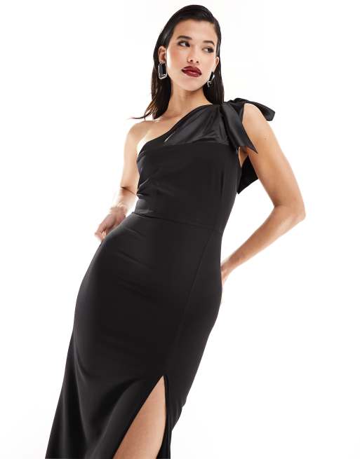 Vestido largo negro con abertura hasta el muslo y detalle de lazo de satén en contraste de Vesper