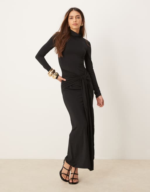 Vestido largo negro de manga larga con cuello alzado y lazada en la parte lateral delantera de Gina Tricot