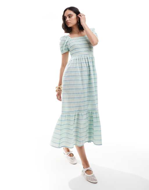 Vestido largo verde a rayas con mangas abullonadas de Esmée