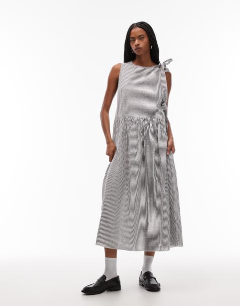 Vestido midi a rayas grises y blancas cruzado con detalle de lazada de COLLUSION - view 1