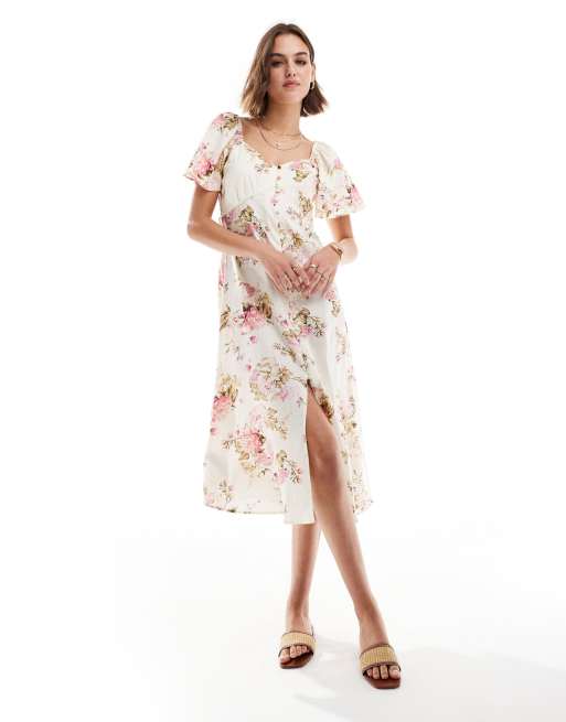 Vestido midi blanco abotonado con estampado floral de Mango