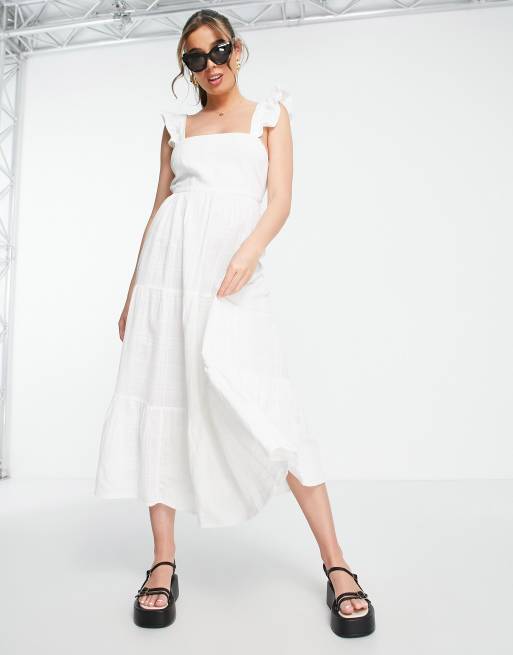  Vestido midi blanco escalonado con volantes en los tirantes y espalda al aire de New Look