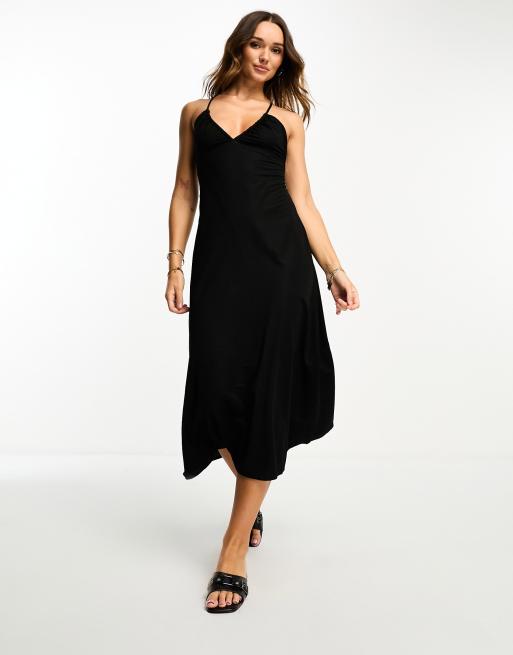 Vestido midi negro con espalda cruzada de Mango