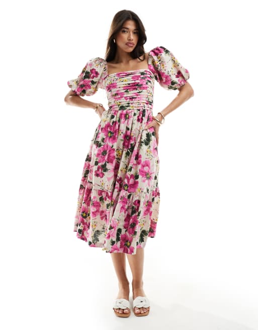 Vestido midi rosa con estampado floral y mangas abullonadas de