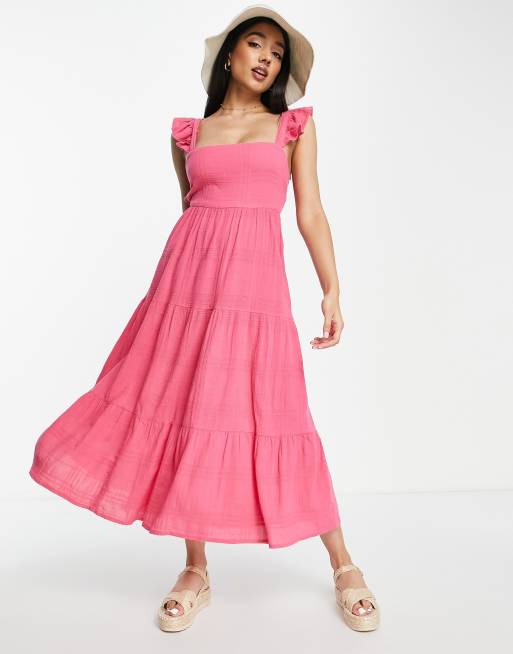 Vestido midi rosa escalonado con lazada en la espalda de New Look