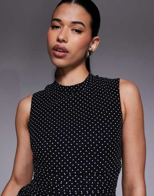Vestido negro sin mangas con estampado de lunares, cuello alto y cintura baja con bajo plisado exclusivo de The Frolic, 4 de 4