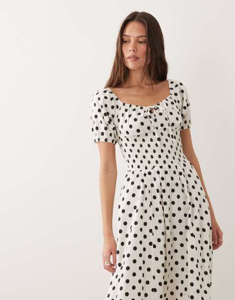 Vestido playero largo negro y blanco con estampado de lunares, mangas abullonadas y lazada delantera de Esmee - view 1