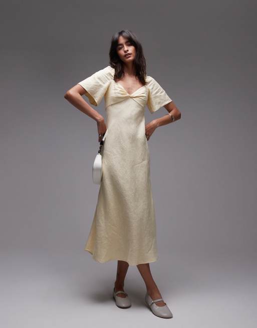 Vestido semilargo beis claro con mangas abullonadas y escote corazón con detalle retorcido de lino de & Other Stories