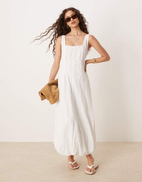 Vestido semilargo blanco estructurado con bajo abullonado de algodón suave de Mango - view 1