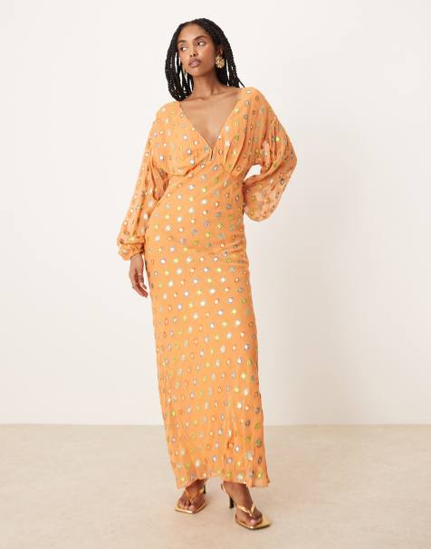 Vestido semilargo color coral con estampado de lunares dorado metalizado de Never Fully Dressed - view 1