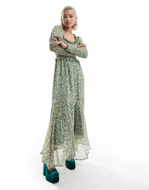 Vestido semilargo verde fruncido con estampado floral y detalle de lazada en la espalda de sister jane