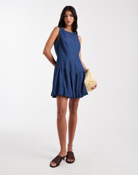 Vestido vaquero corto azul medio con cintura baja y bajo abullonado de Pieces - view 1