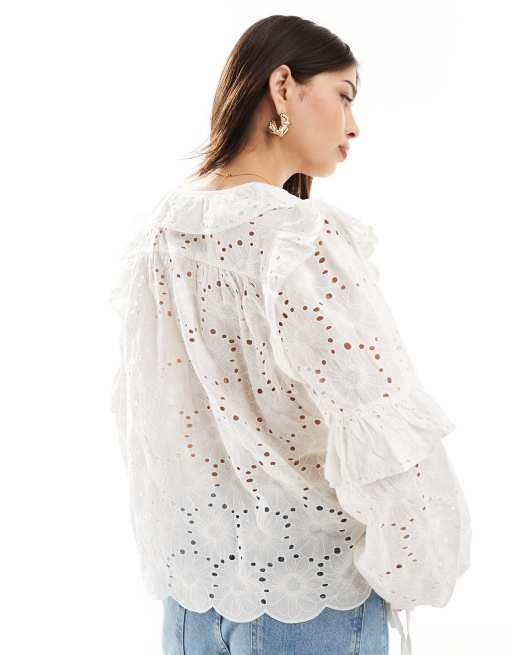Vila Blusa in pizzo bianca allacciata sul davanti con scollo a V
