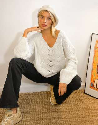 white cable knit v neck sweater