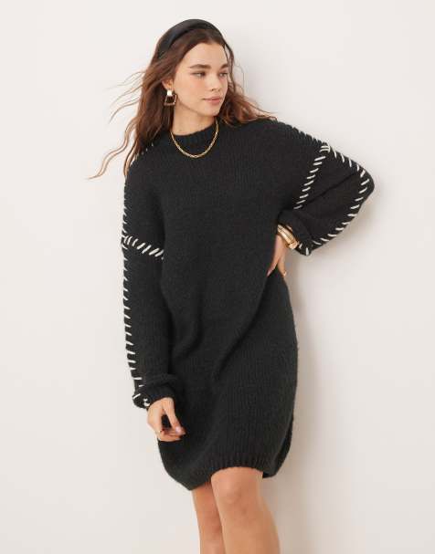 VILA – Kurzes, gestricktes Pulloverkleid in Schwarz mit Kontrastnaht - view 1