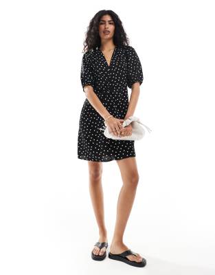 mini dress with tie bow back in black and white polka dot print