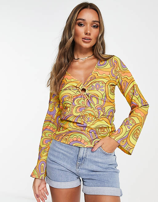 Vila ring detail top with flared sleeves in 60s retro print