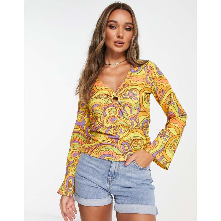 Vila ring detail top with flared sleeves in 60s retro print | ASOS