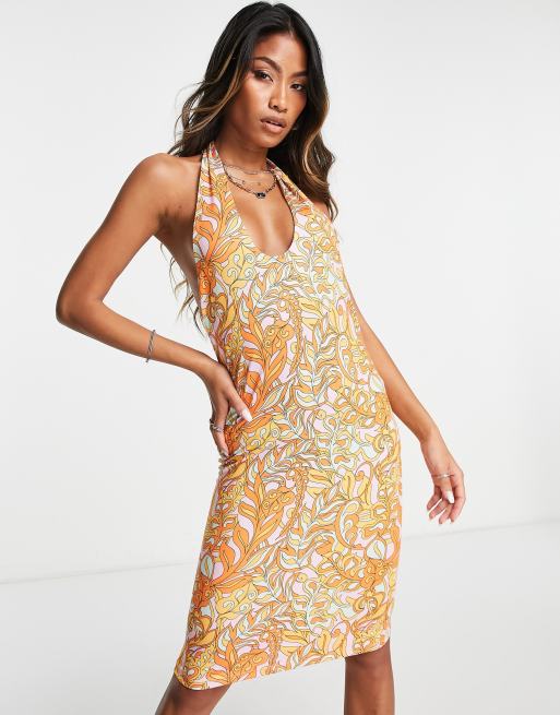 Vila - Robe courte à fleurs en jersey avec encolure croisée et dos nu