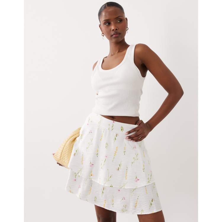 Vila tiered flippy mini skirt in white floral garden print | ASOS