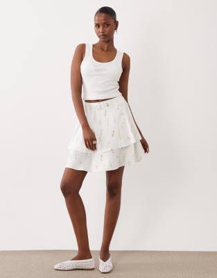 Vila tiered flippy mini skirt in white floral garden print | ASOS