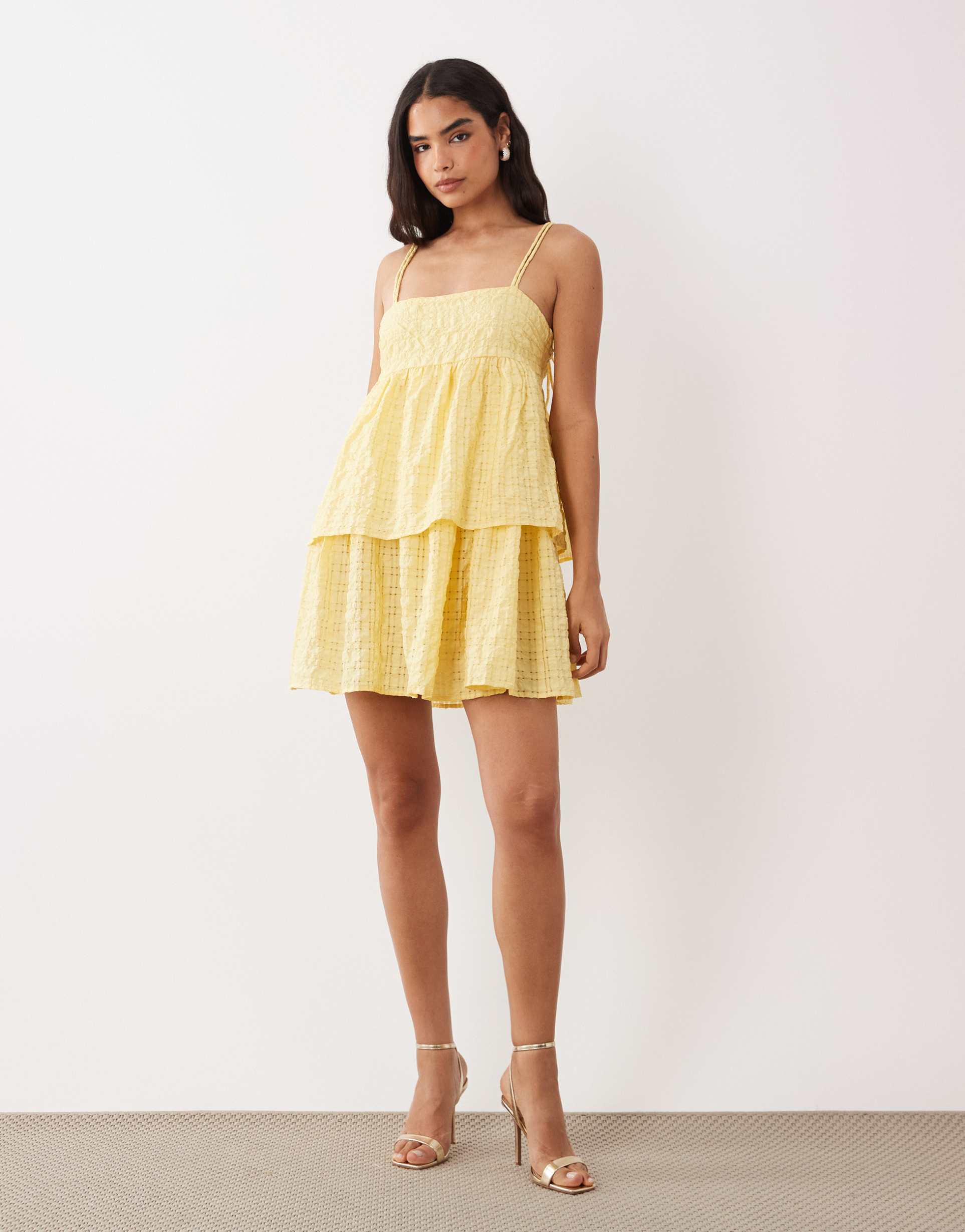 vila tiered gingham textured mini dress in pastel yellow