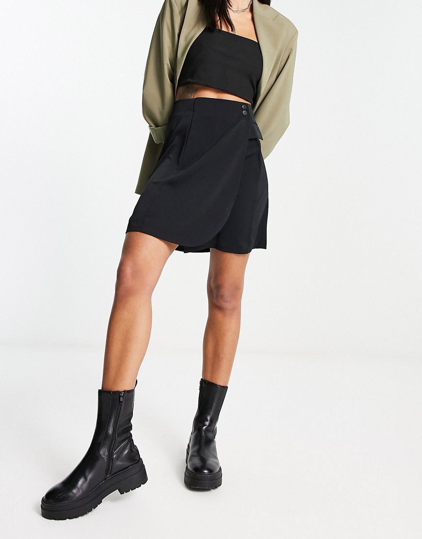 wrap style mini skirt with button detail in black