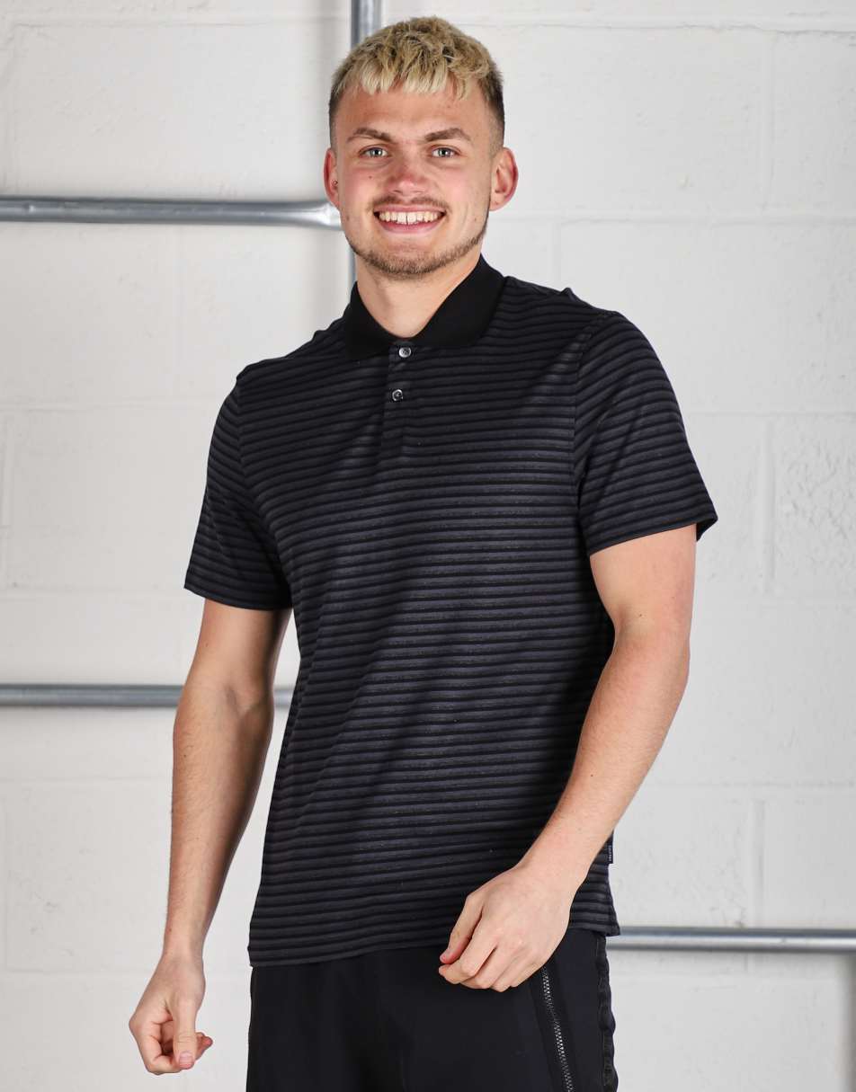 Vintage Calvin Klein Size S short sleeve polo shirt in black stripe